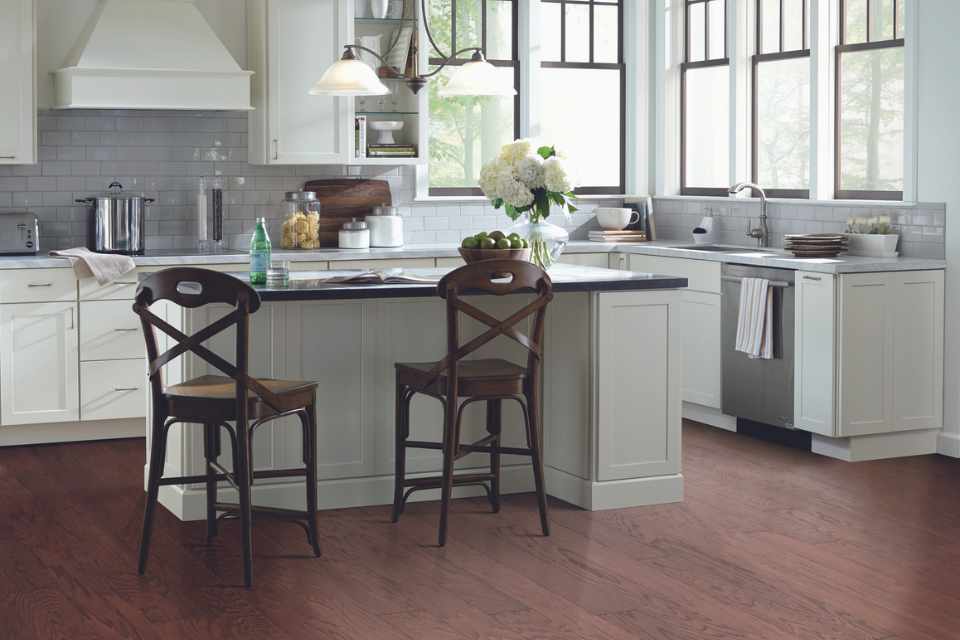 dark hardwood flooring in white modern kitchen